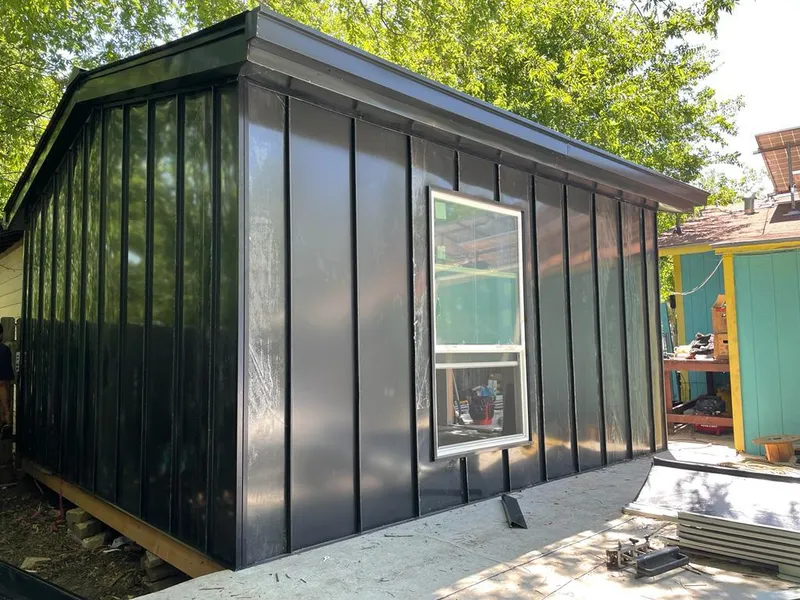 Black standing seam metal wall panels for Roof Inspection in Hammond