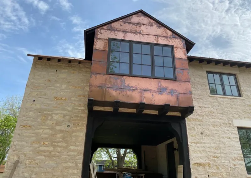 Copper metal panel facade on a stone building for Metal Roof Coating in Hammond